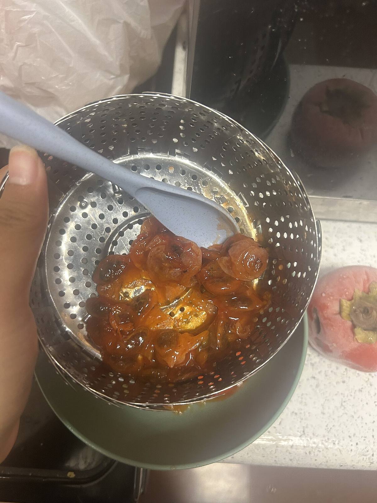 Fuyu persimmon fruits, one cut open (American Persimmon)