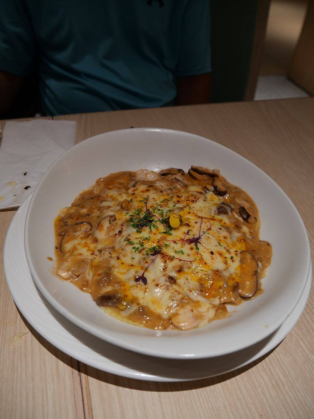 Mushroom sauce baked Italian Dumplings from The Spaghetti House (Baked Ravioli)