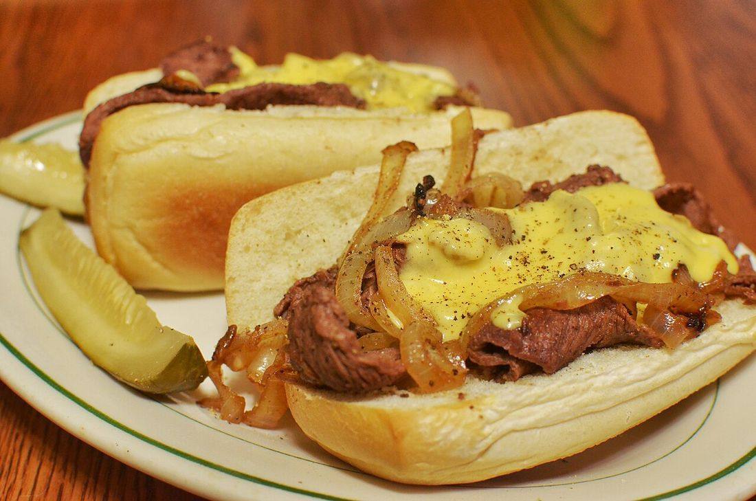 Cheesesteak sandwiches with pickles (Cheesesteaks)