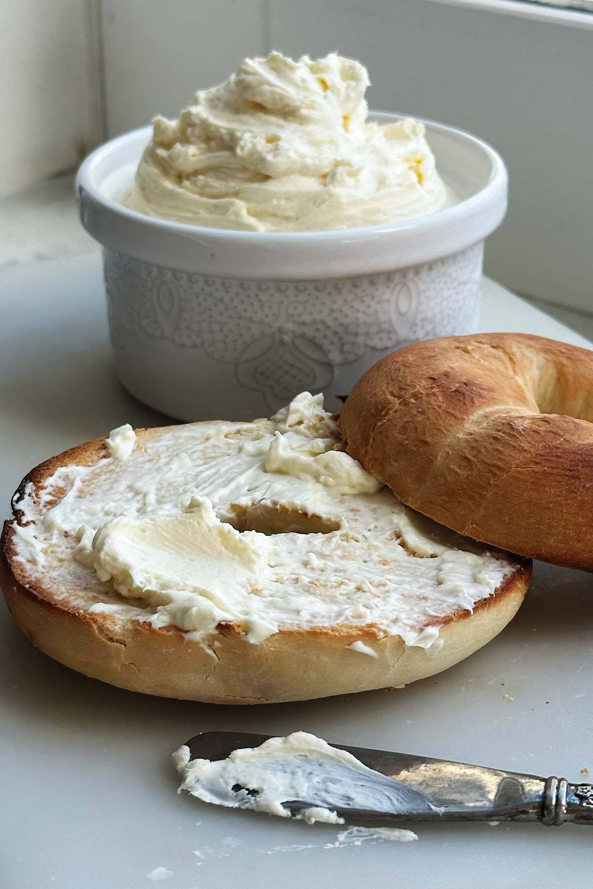 A block of cream cheese on a board