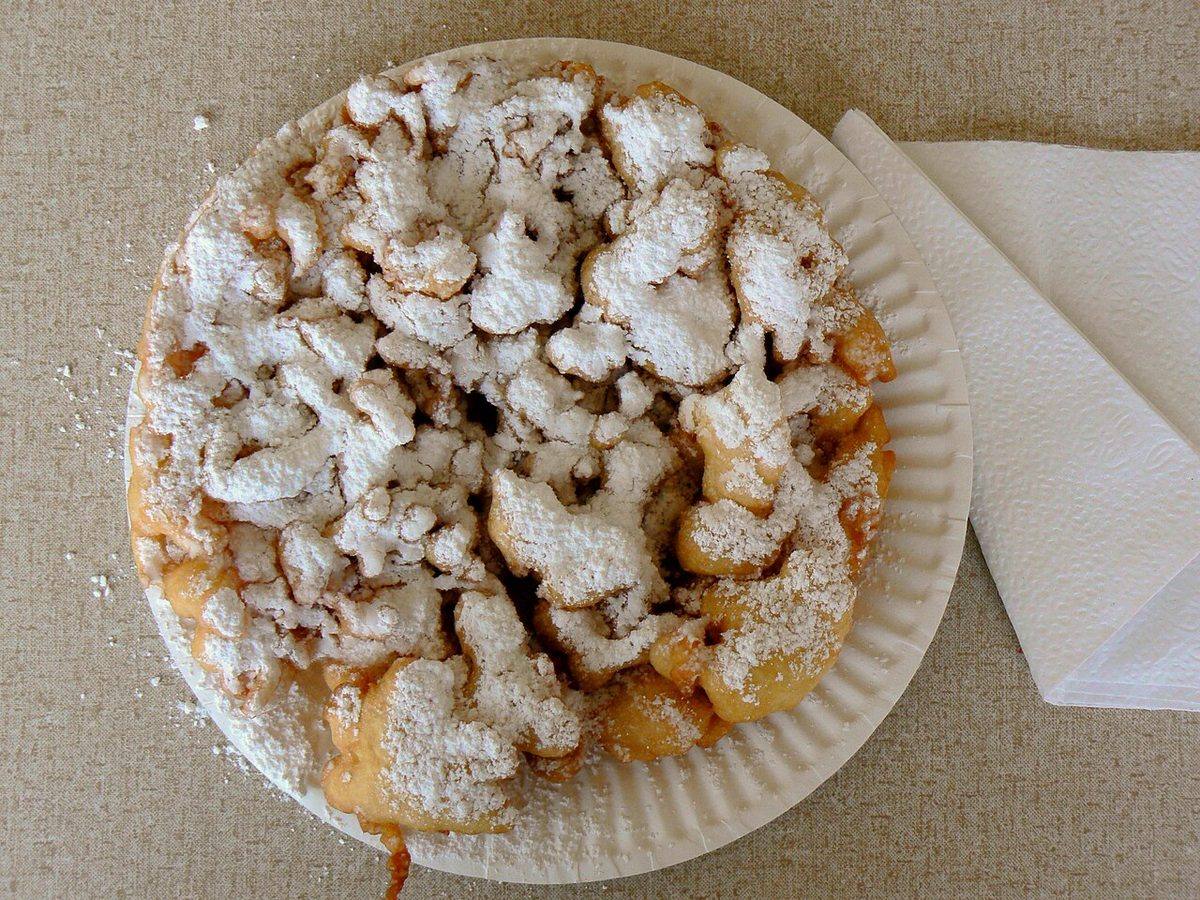 A funnel cake on a paper plate (Funnel Cake)