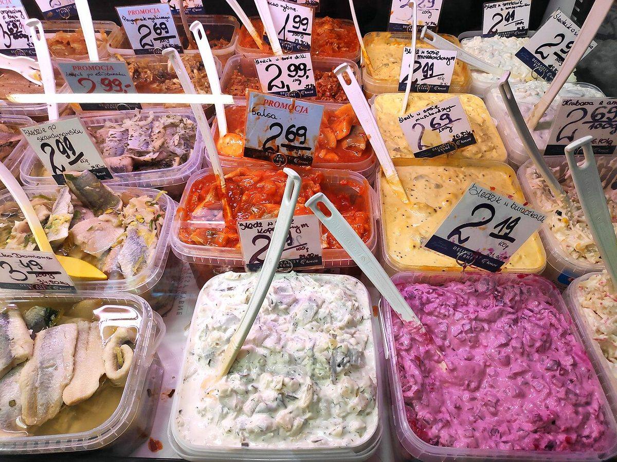 043 Śledzie - variety of herring salad types in specialty fish store in Poland (Herring)