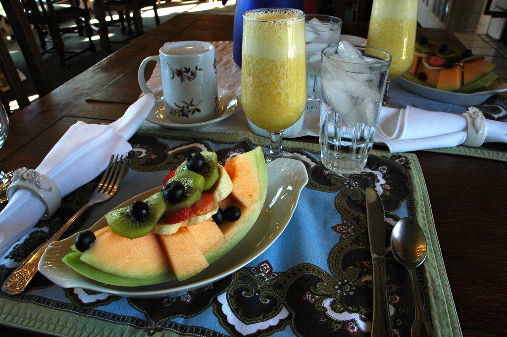 California breakfast, fresh melon with kiwis, strawberries, bananas, blueberries, fresh orange juice mimosa,...