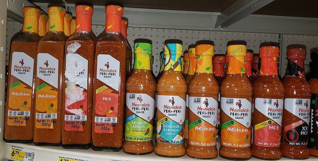 Nando's peri peri sauces on a grocery store shelf