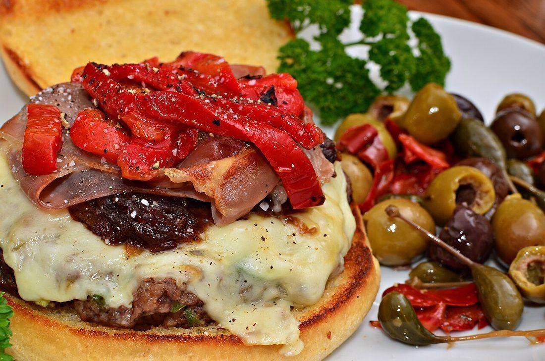 Cheeseburger with red onion jam, prosciutto, and roasted red peppers