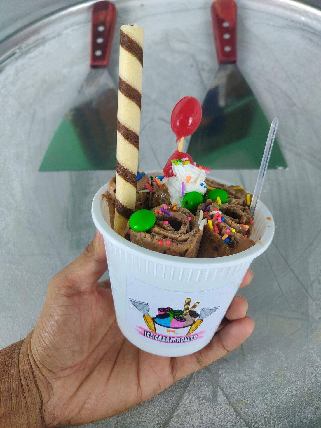 Ice Cream Rolled with Chocolate, stick wafer rolls and whipped cream (Rolled Ice Cream)