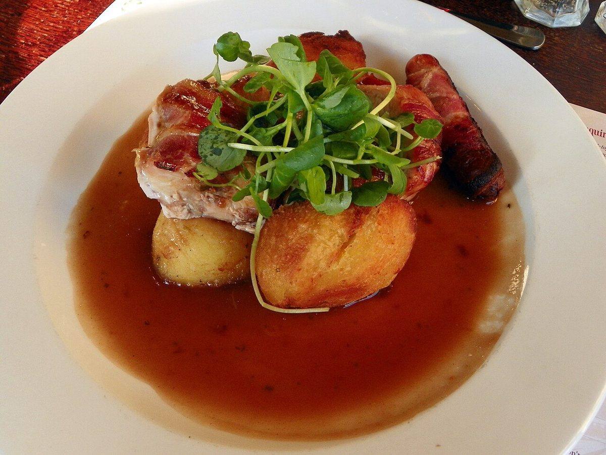 Roasted turkey roulade with sage, onion & cranberry stuffing, roast potatoes, pigs in blankets, seasonal...