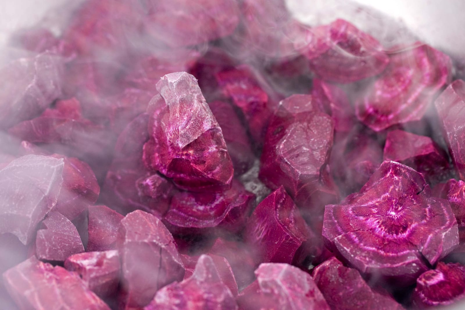 Frozen beetroot broken open, showing ice crystals