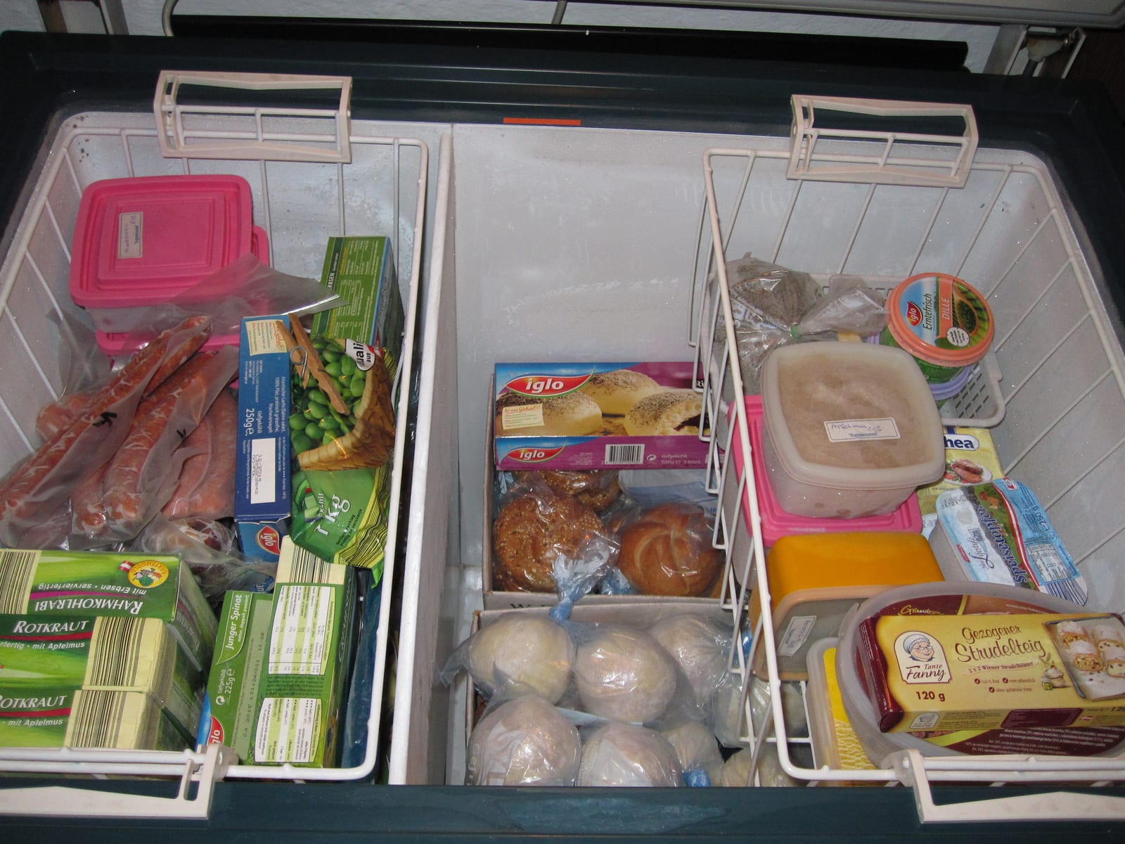 A deep freezer filled with packaged food for long-term storage